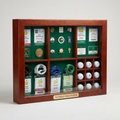 Large cherry display case with golf volunteer badges, pins and golf balls - The Tournament Gallery